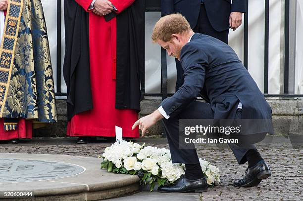 Prince Harry lays a wreath at the service of commemoration for the victims of the 2015 terrorist attacks In Tunisia at Westminster Abbey on April 12,...