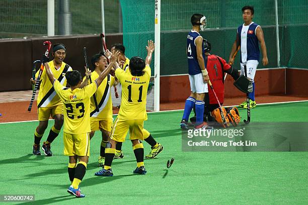 Brunei players celebrate their victory against Vietnam during round 1 of the 2016 Hockey World League at Sengkang Hockey Stadium on April 12, 2016 in...