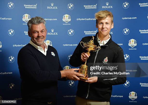 Europe's Ryder Cup captain Darren Clarke with son Tyrone Clarke at Royal Portrush golf club as part of the Ryder Cup Trophy Tour launch on April 12,...