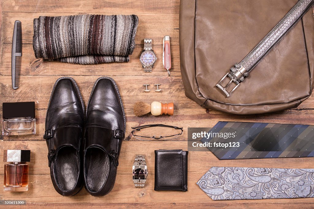 Men's accessories organized on table.  No people.  Knolling.