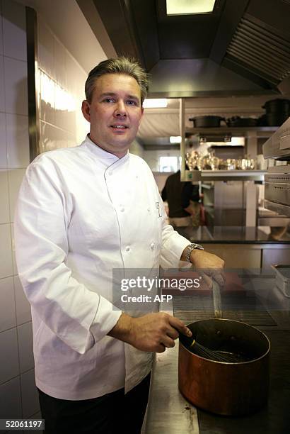 Chef Peter Goossens poses in the kitchen of his restaurant 25 January 2005 in Kruishoutem, western Belgium. Belgium added a third restaurant to its...