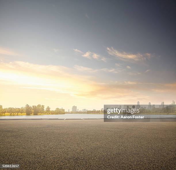 lake parking lot - sunset city stock pictures, royalty-free photos & images