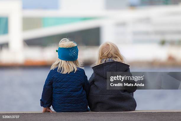 kids contemplating from behind - oslo people stock pictures, royalty-free photos & images