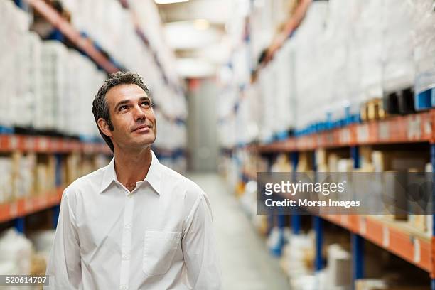 supervisor in warehouse - looking up stock pictures, royalty-free photos & images
