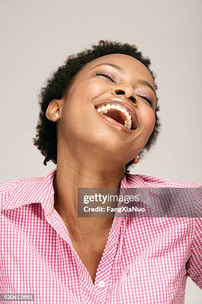 young woman laughing, close-up - bending over backwards stock pictures, royalty-free photos & images