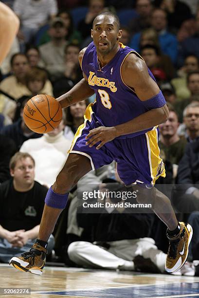 Kobe Bryant of the Los Angeles Lakers moves the ball during the game against the Minnesota Timberwolves on January 10, 2005 at the Target Center in...