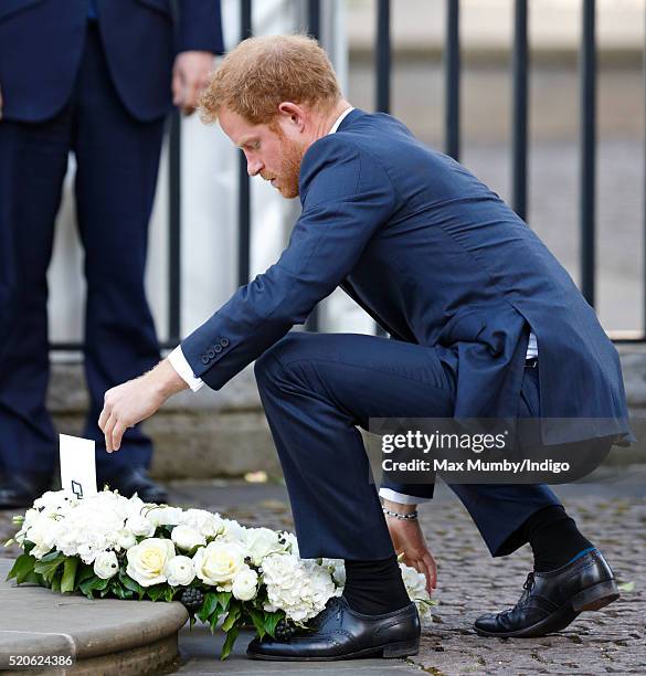 Prince Harry lays a wreath as he attends a Service of Commemoration for victims of the 2015 Terrorist Attacks in Tunisia at Westminster Abbey on...