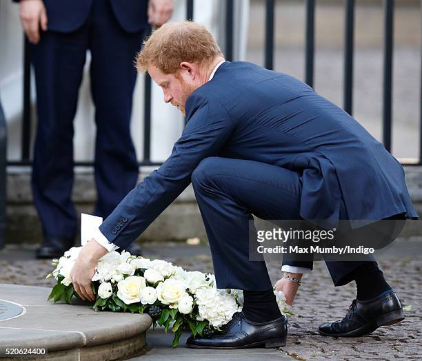 Prince Harry lays a wreath as he attends a Service of Commemoration for victims of the 2015 Terrorist Attacks in Tunisia at Westminster Abbey on...