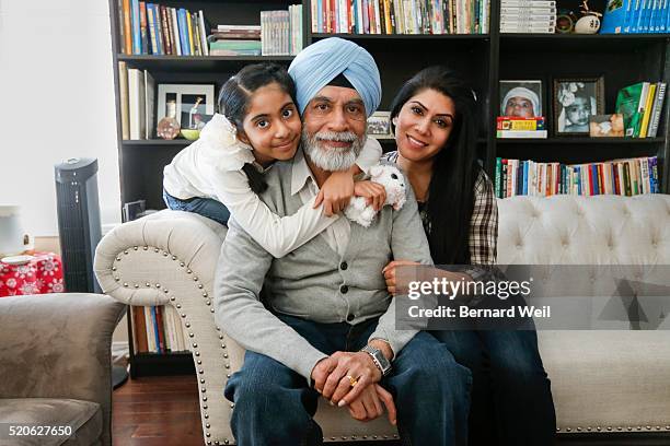 Baldev Mutta , CEO of Brampton's Punjabi Community Health Services, is surrounded by his grand daughter Talon Mutta, 9 and daughter Rakhi Mutta....