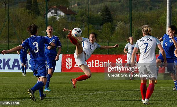 Karen Carney of England beats Antonela Radeljic of Bosnia to score the opening goal during the UEFA Women's European Championship Qualifier match...