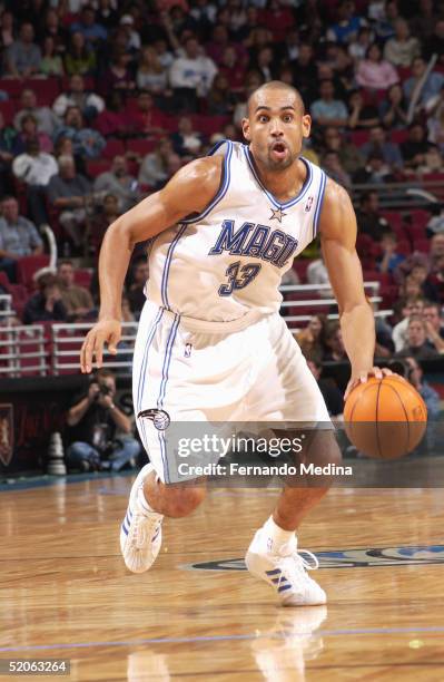 Grant Hill of the Orlando Magic moves the ball during the game against the Milwaukee Bucks at TD Waterhouse Centre on December 29, 2004 in Orlando,...