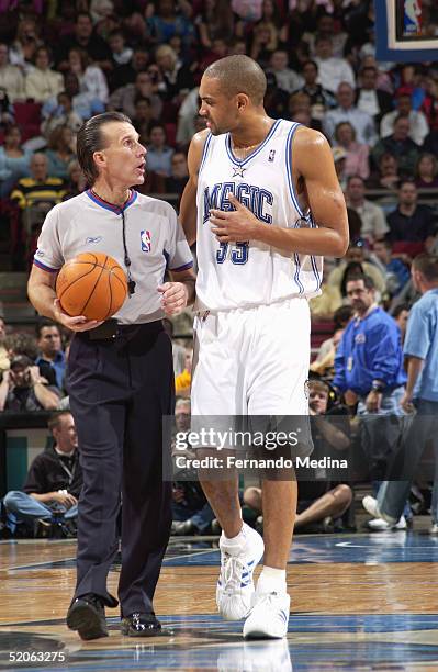 Grant Hill of the Orlando Magic talks with referee during the game against the Milwaukee Bucks at TD Waterhouse Centre on December 29, 2004 in...