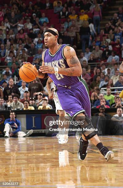 Marcus Fizer of the Milwaukee Bucks moves the ball during the game against the Orlando Magic at TD Waterhouse Centre on December 29, 2004 in Orlando,...