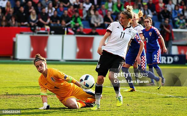 Doris Bacic of Croatia challenges Anja Mittag of Germany during the UEFA Women's Euro 2017 qualifier between Germany and Croatia at Osnatel Arena on...