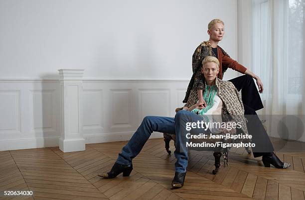 Actress Tilda Swinton is photographed for Madame Figaro on February 6, 2016 in Paris, France. Left: Coat and vest , shirt and boots , jeans , bag ....