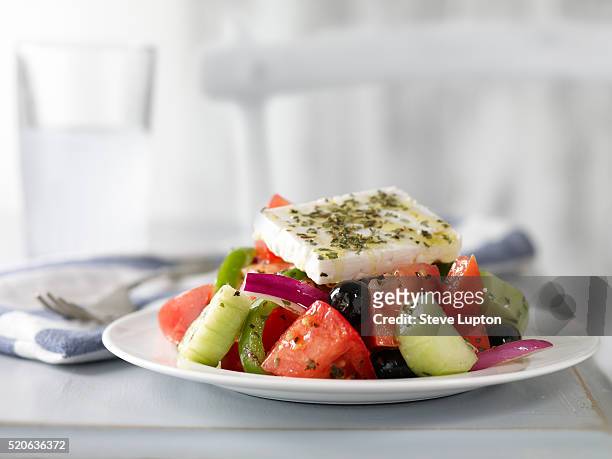 traditional greek salad served with a glass of ouzo - ouzo stock pictures, royalty-free photos & images