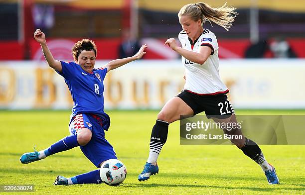 Tabea Kemme of Germany is challenged by Violeta Baban of Croatia during the UEFA Women's Euro 2017 qualifier between Germany and Croatia at Osnatel...