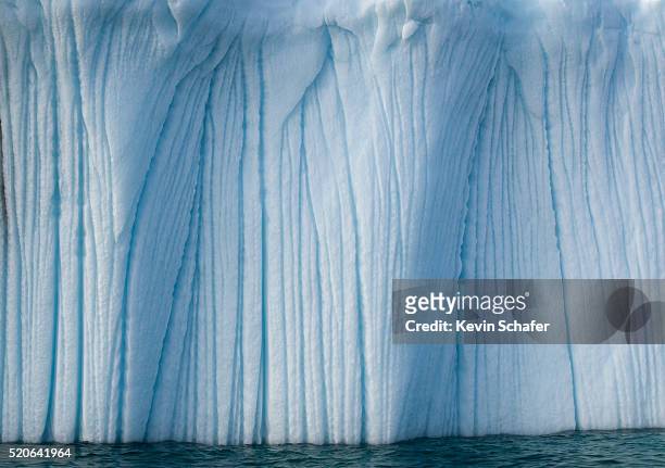 striated face of grounded iceberg - baffin island stockfoto's en -beelden