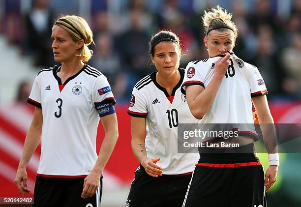 Alexndra Popp of Germany looks on next to Saskia Bartusiak of Germany and Dzsenifer Marozsan of Germany during the UEFA Women's Euro 2017 qualifier...