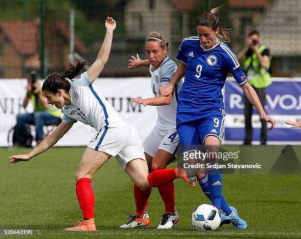 Milena Nikolic of Bosnia in action against Jordan Nobbs and Karen Carney of England during the UEFA Women's European Championship Qualifier match...