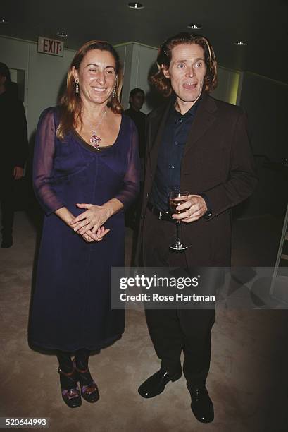 Italian fashion designer and entrepreneur, Miuccia Prada with American film and stage actor, Willem Dafoe, at the Prada boutique opening party, New...