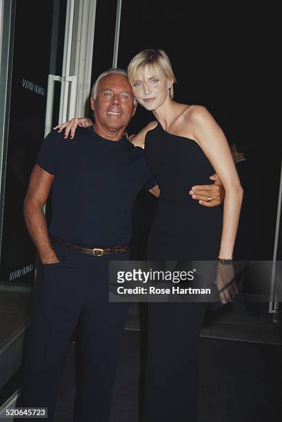 German model and actress Nadja Auermann and Italian fashion designer Giorgio Armani at the opening of the Armani store in New York City, USA, 1996.