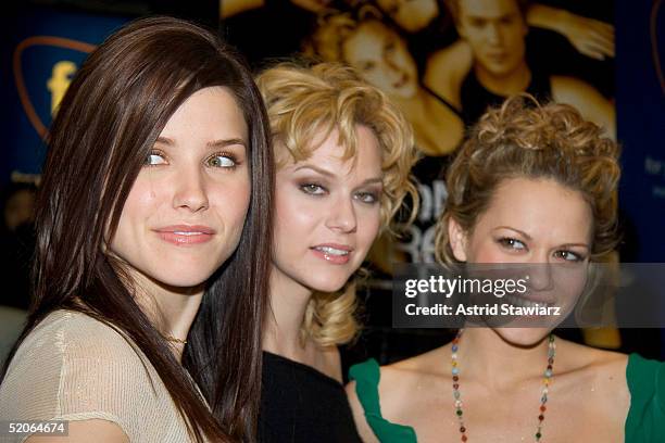 Actresses Sophia Bush, Hilarie Burton and Bethany Joy Lenz of "One Tree Hill" pose during an appearance at the FYE music store to sign CD's of the...