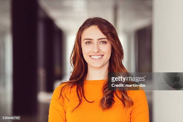 smiling woman's portrait - redhead stock pictures, royalty-free photos & images