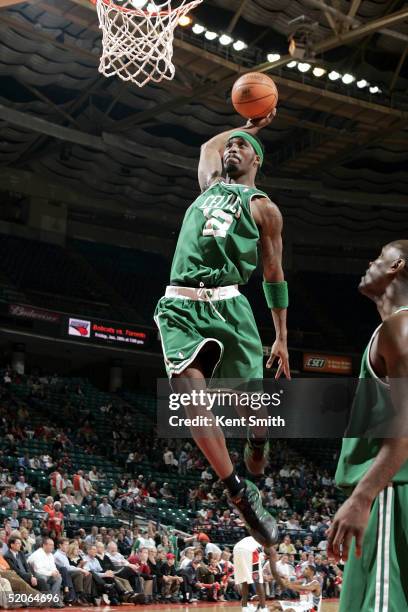 Ricky Davis of the Boston Celtics goes up for a dunk against the Charlotte Bobcats on January 25, 2005 at the Charlotte Coliseum in Charlotte, North...