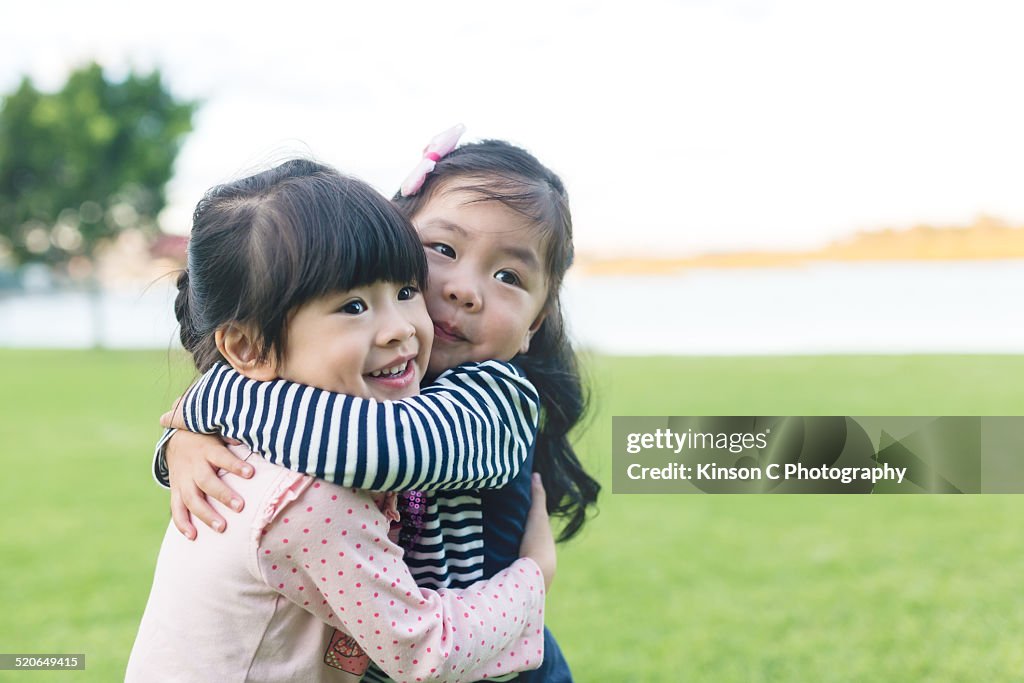 Two girls hugging each other