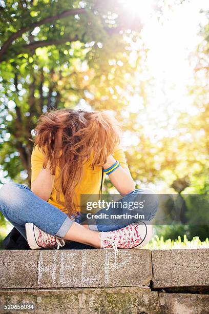 sad girl with head in hands - memories text stock pictures, royalty-free photos & images