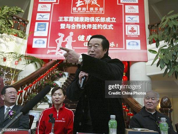 Former China track coach Ma Junren takes a question during an opening ceremony of his protegee, Olympic running champion Wang Junxia's Running Club...