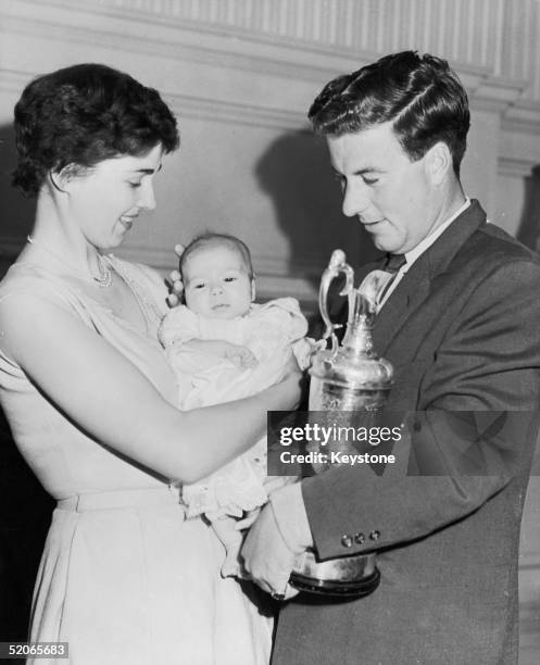 Australian golfer Peter Thomson and his wife Lois attend the christening of their eight-week-old daughter Deirdre at the Luther Tyndale Memorial...