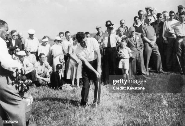 Australian golfer Peter Thomson playing on the 16th green during the Open Golf Championships at St Andrews, 5th July 1957.