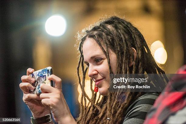 Fan takes a photo of actor Rose McIver as she discusses her show "iZombie" with AOL Build at AOL Studios In New York on April 12, 2016 in New York...