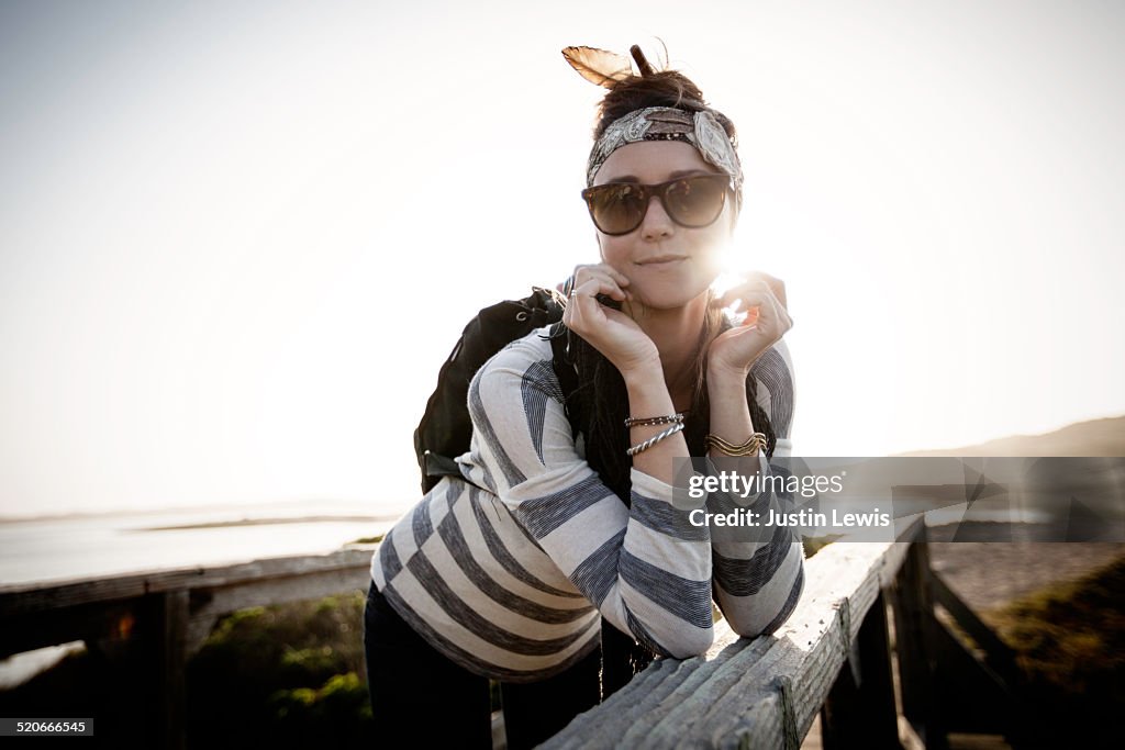 Fashionable young woman relaxing on pier