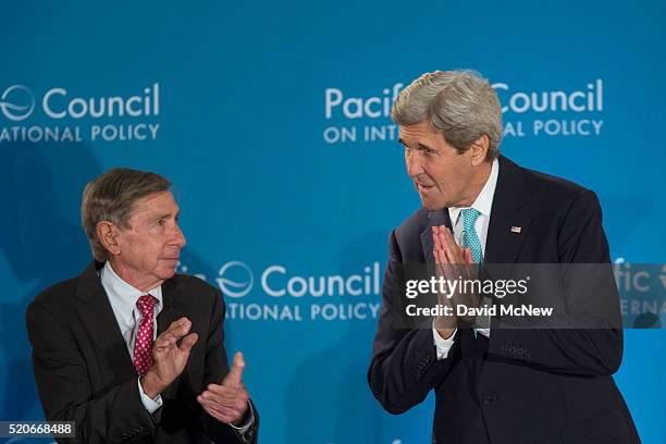 Former U.S. Trade Ambassador Michael "Mickey" Kantor applauds as United States Secretary of State John Kerry arrives to address the Pacific Council...