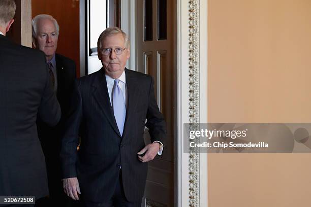 Senate Majority Leader Mitch McConnell and Sen. John Cornyn leave their weekly policy luncheon at the U.S. Capitol April 12, 2016 in Washington, DC....