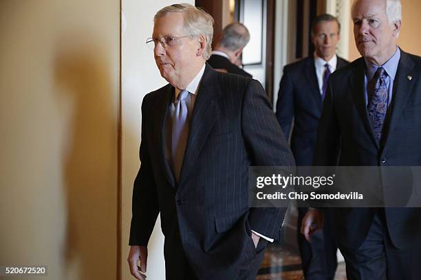 Senate Majority Leader Mitch McConnell , Sen. John Thune and Sen. John Cornyn leave their weekly policy luncheon at the U.S. Capitol April 12, 2016...