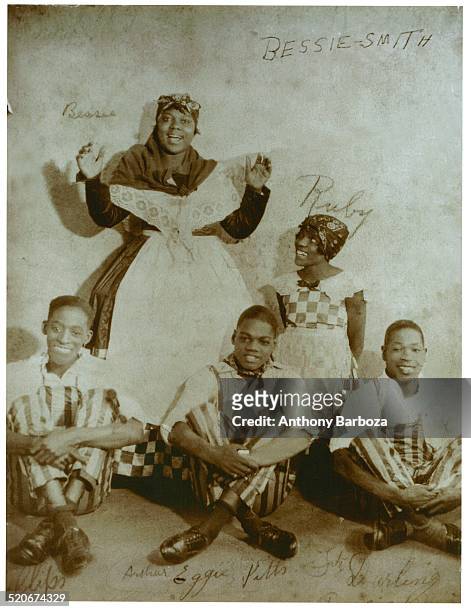 Publicity portrait of American blues singers Bessie Smith and her neice, Ruby Smith as they pose with song and dance trio, the Dancing Sheiks, led by...