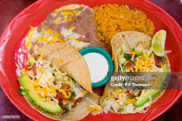 tacos dinner with rice and re fried beans - cucina messicana foto e immagini stock