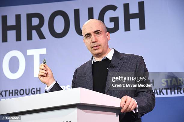 Yuri Milner, Breakthrough Prize and DST Global Founder, demonstrates a new chip on stage as Yuri Milner and Stephen Hawking host press conference to...