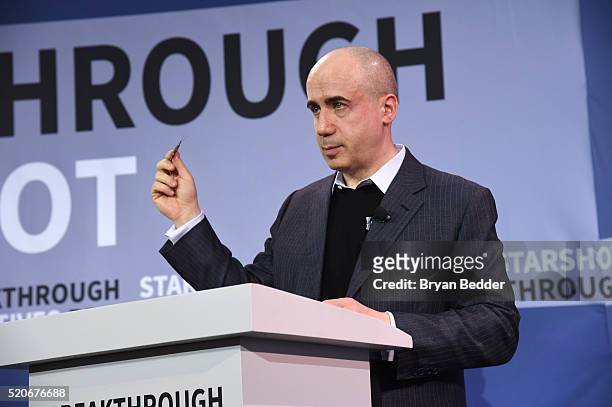 Yuri Milner, Breakthrough Prize and DST Global Founder, demonstrates a new chip on stage as Yuri Milner and Stephen Hawking host press conference to...