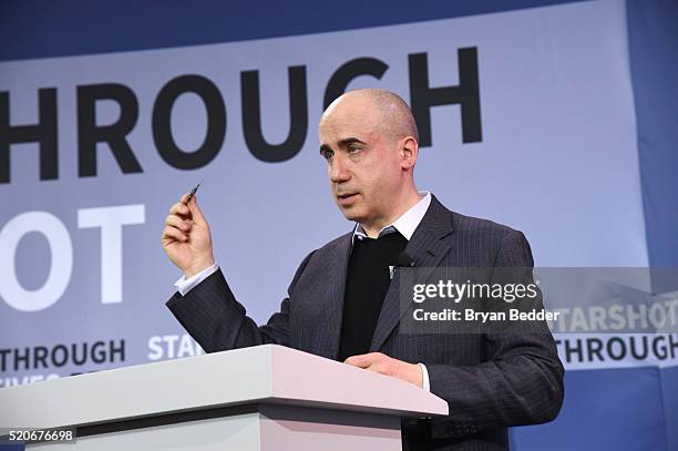 Yuri Milner, Breakthrough Prize and DST Global Founder, demonstrates a new chip on stage as Yuri Milner and Stephen Hawking host press conference to...