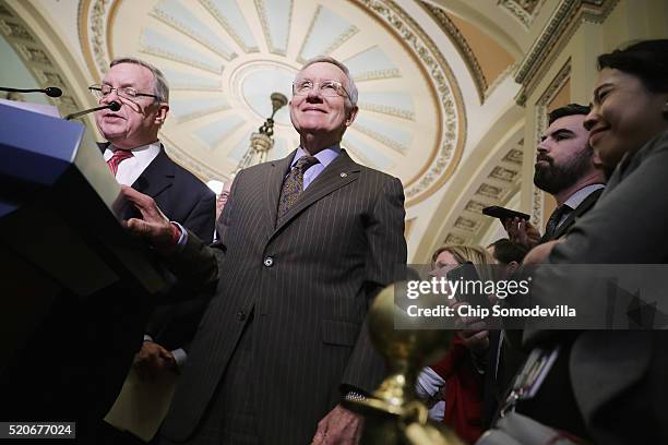 Senate Minority Leader Harry Reid and Senate Minority Whip Richard Durbin talk to reporters following the weekly Senate Democratic policy luncheon at...