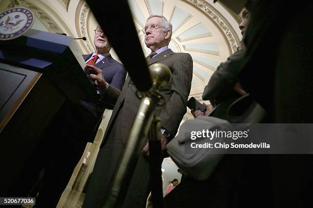 Senate Minority Leader Harry Reid Sen. Charles Schumer talk to reporters following the weekly Senate Democratic policy luncheon at the U.S. Capitol...