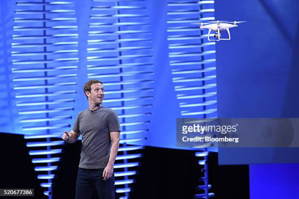Mark Zuckerberg, founder and chief executive officer of Facebook Inc., views a drone flying while speaking at the Facebook F8 Developers Conference...