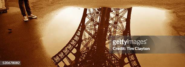 the eiffel tower in paris, france - sepia toned bildbanksfoton och bilder