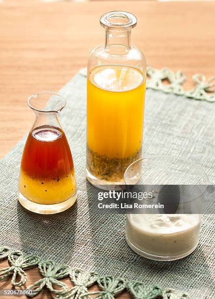 various mixed salad dressings in glass containers - vinegrette stock pictures, royalty-free photos & images