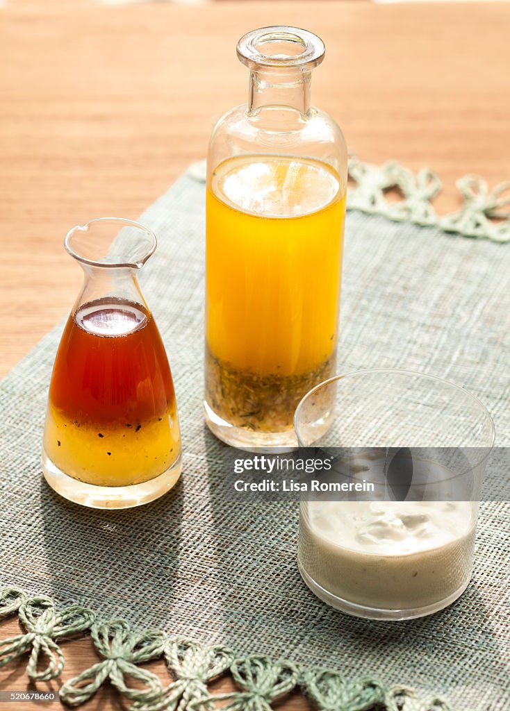 Various mixed salad dressings in glass containers